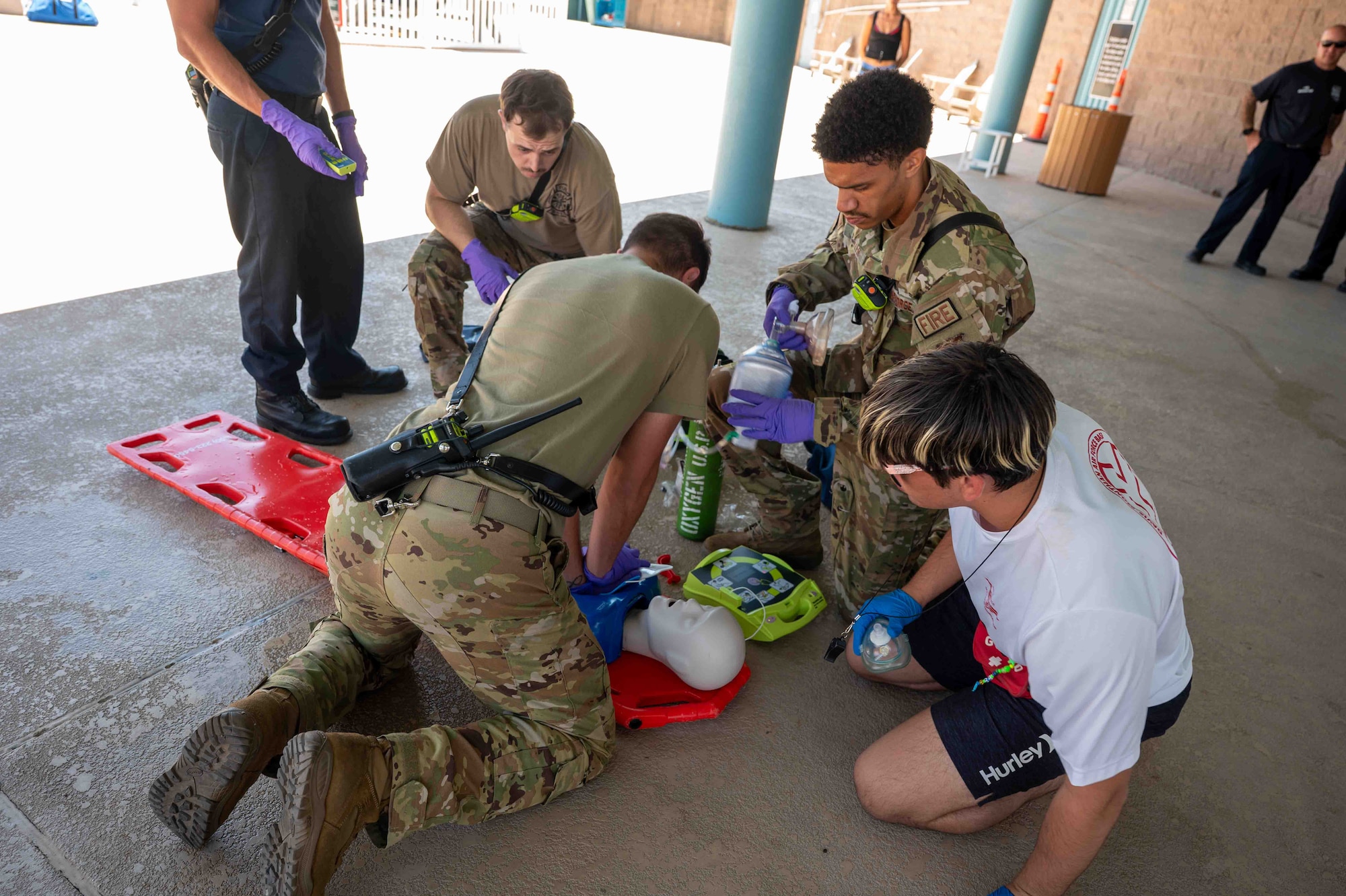 Fire Airmen perfom CPR.