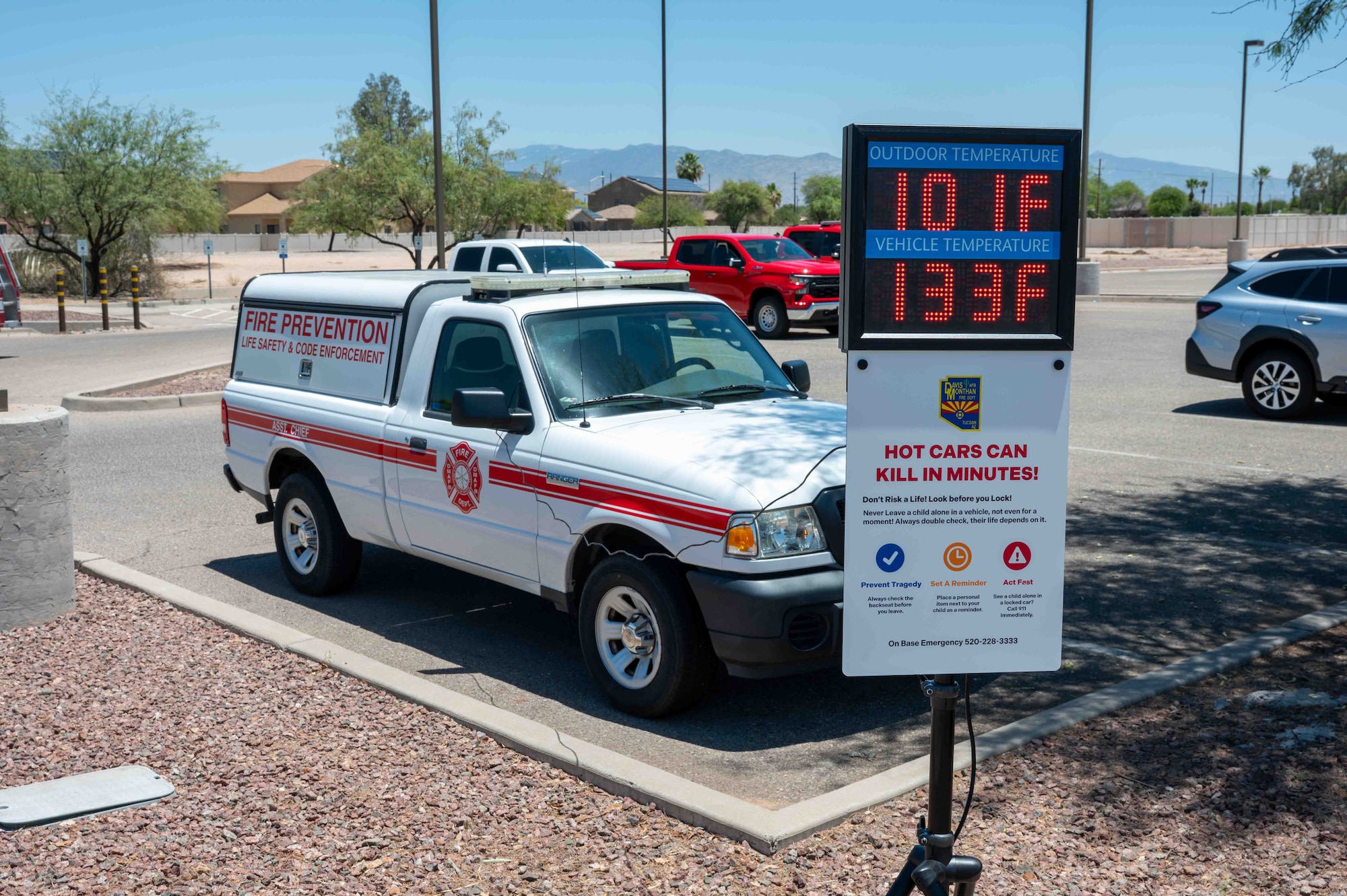The fire department demonstrates a car temperature thermometer.