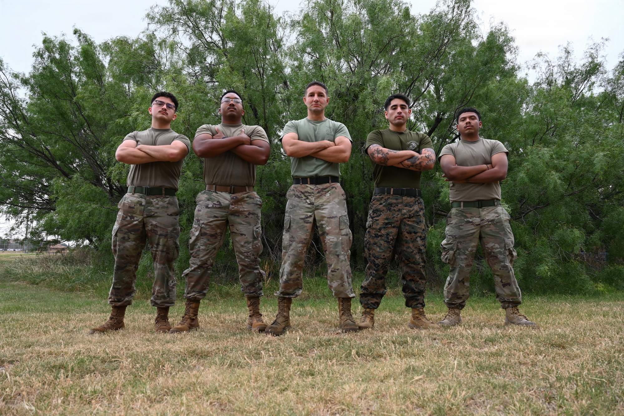 Airmen and Marines wrestle