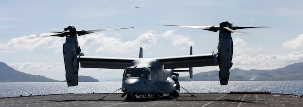 U.S. Marines and Royal Sailors load an MV-22B Osprey on the HMS Illustrious in the Philippine Sea, Nov. 27, 2013. The HMS Illustrious deployed to the Philippines in support of the Typhoon Haiyan disaster relief effort during Operation Damayan. (U.S. Marine Corps photo by Lance Cpl. Luis A. Rodriguez III/ Released)