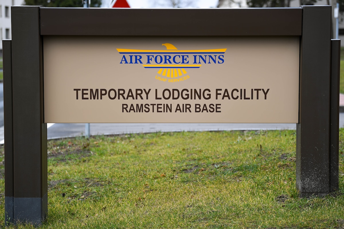 A sign for a new temporary lodging facility is displayed at Ramstein Air Base, Germany, Feb. 23, 2022. In addition to providing more lodging for PCSing families, the TLF increases Ramstein’s ability to host transit personnel and temporarily deployed units on the installation. (U.S. Air Force photo by Airman 1st Class Jared Lovett)