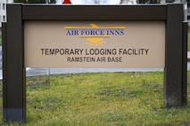 A sign for a new temporary lodging facility is displayed at Ramstein Air Base, Germany, Feb. 23, 2022. In addition to providing more lodging for PCSing families, the TLF increases Ramstein’s ability to host transit personnel and temporarily deployed units on the installation. (U.S. Air Force photo by Airman 1st Class Jared Lovett)