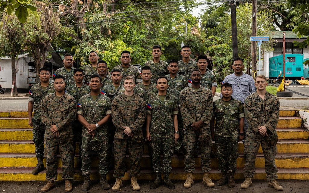U.S. Marines with Air Naval Gunfire Liaison Company Detachment - North, Marine Rotational Force – Southeast Asia, I Marine Expeditionary Force, and Philippine marines pose for a photo during a bilateral fires and effects training for Archipelagic Coastal Defense Continuum 26.3 on Fort Bonifacio, Philippines, June 3, 2026.