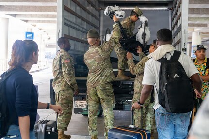 Team Army competitors load their competitor equipment into a box truck after arriving at San Antonio International Airport ahead of the 2026 Warrior Games June 8, 2026.