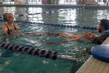 U.S. Army Spc. Jeyson Ruiz participates in swimming drill with assistance from Krista Argiolas, a Team Army Recovery Consultant, and Eli English, Fort Benning’s Adaptive Reconditioning Lead, at Team Army’s Warrior Games Training Camp in San Antonio, Texas, June 9, 2026