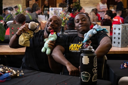 Retired U.S. Army Cpt. Tony J. Smith (left) and Cpl. Delas Bush (right) pose for a photo at the welcome lunch hosted by the USO in anticipation
