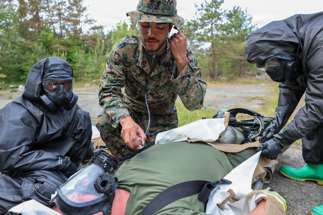 260608-N-HS756-1037 LIEPAJA, Latvia (June 8, 2026) Hospital Corpsman 3rd Class Dante Hendrix, assigned to 2nd Light Armored Reconnaissance Battalion (2nd LAR BN), checks vital signs while using a stethoscope during a Chemical, Biological, Radiological, and Nuclear (CBRN) training evolution during exercise Baltic Operations (BALTOPS) 2026, in Liepaja, Latvia, June 8, 2026. BALTOPS 2026, the premiere maritime-focused exercise in the Baltic Sea region, provides a unique training opportunity to strengthen combined response capabilities critical to preserving freedom of navigation and security in the Baltic Sea. (U.S. Navy photo by Mass Communication Specialist 3rd Class Sisi Lopez Barahona)