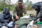 260608-N-HS756-1037 LIEPAJA, Latvia (June 8, 2026) Hospital Corpsman 3rd Class Dante Hendrix, assigned to 2nd Light Armored Reconnaissance Battalion (2nd LAR BN), checks vital signs while using a stethoscope during a Chemical, Biological, Radiological, and Nuclear (CBRN) training evolution during exercise Baltic Operations (BALTOPS) 2026, in Liepaja, Latvia, June 8, 2026. BALTOPS 2026, the premiere maritime-focused exercise in the Baltic Sea region, provides a unique training opportunity to strengthen combined response capabilities critical to preserving freedom of navigation and security in the Baltic Sea. (U.S. Navy photo by Mass Communication Specialist 3rd Class Sisi Lopez Barahona)