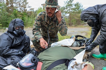 260608-N-HS756-1037 LIEPAJA, Latvia (June 8, 2026) Hospital Corpsman 3rd Class Dante Hendrix, assigned to 2nd Light Armored Reconnaissance Battalion (2nd LAR BN), checks vital signs while using a stethoscope during a Chemical, Biological, Radiological, and Nuclear (CBRN) training evolution during exercise Baltic Operations (BALTOPS) 2026, in Liepaja, Latvia, June 8, 2026. BALTOPS 2026, the premiere maritime-focused exercise in the Baltic Sea region, provides a unique training opportunity to strengthen combined response capabilities critical to preserving freedom of navigation and security in the Baltic Sea. (U.S. Navy photo by Mass Communication Specialist 3rd Class Sisi Lopez Barahona)