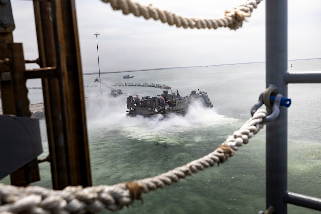 A U.S. Navy landing craft, air cushion, assigned to Assault Craft Unit 4, disembarks amphibious assault ship USS Kearsarge (LHD 3) during 26th Marine Expeditionary Unit’s Type Commanders Amphibious Training (TCAT) while pierside Naval Station Norfolk, Virginia, June 9, 2026. TCAT is a military exercise designed to enhance mobility and integration between the U.S. Marine Corps and the U.S. Navy. The training focuses on improving the necessary skills for real-world operations and effective collaboration between Marine Corps and Naval teams. (U.S. Marine Corps photo by Cpl. Matthew Williams)