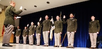 Illinois Army National Guard 1st Lt. Floyd Bastien administers the State of Illinois Oath of Office to five newly commissioned Illinois Army National Guard second lieutenants during Northern Illinois University’s Army ROTC Commissioning Ceremony.