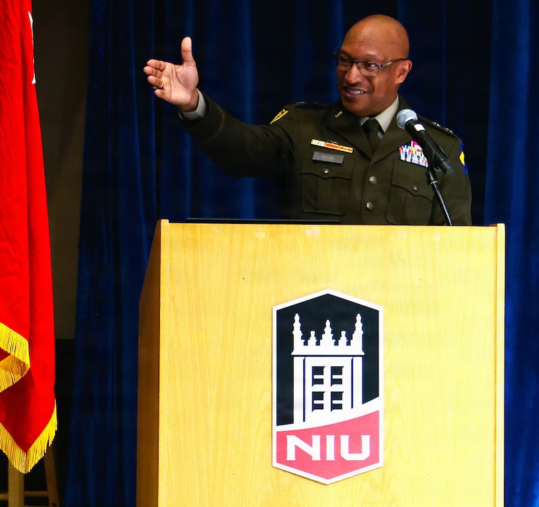 Maj. Gen. Rodney Boyd, The Adjutant General of Illinois and Commander of the Illinois National Guard, points to Brig. Gen. Jorge Fonseca, the Director of the Illinois National Guard Joint Staff, in the audience during Northern Illinois University’s Army ROTC Commissioning Ceremony.