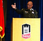 Maj. Gen. Rodney Boyd, The Adjutant General of Illinois and Commander of the Illinois National Guard, points to Brig. Gen. Jorge Fonseca, the Director of the Illinois National Guard Joint Staff, in the audience during Northern Illinois University’s Army ROTC Commissioning Ceremony.