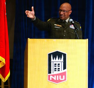 Maj. Gen. Rodney Boyd, The Adjutant General of Illinois and Commander of the Illinois National Guard, points to Brig. Gen. Jorge Fonseca, the Director of the Illinois National Guard Joint Staff, in the audience during Northern Illinois University’s Army ROTC Commissioning Ceremony.