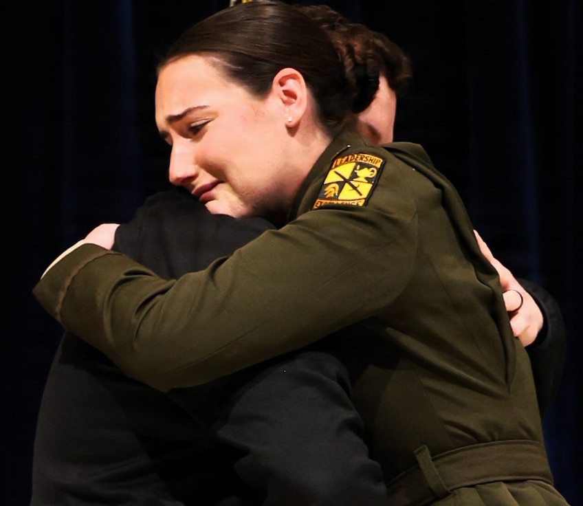 2nd Lt. Jaiden Mitchell hugs Staff Sgt. (ret.) Jon Allen during Northern Illinois University’s Army ROTC Commissioning Ceremony.