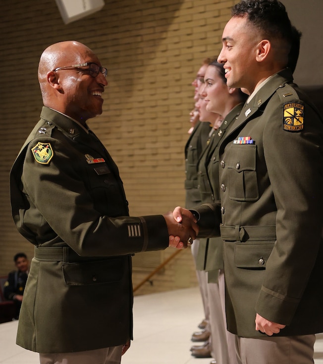 Maj. Gen. Rodney Boyd, The Adjutant General of Illinois and Commander of the Illinois National Guard, congratulates 2nd Lt. Joshua Van Den Broeck, during Northern Illinois University’s Army ROTC Commissioning Ceremony.
