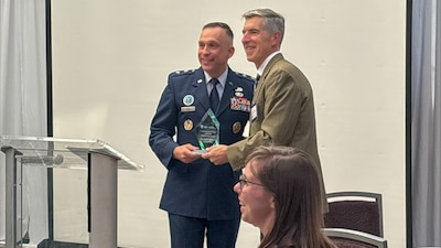 U.S. Air Force Maj. Gen. Lyle K. Drew, acting director of the Defense Threat Reduction Agency (DTRA), receiving award.
