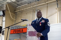 U.S. Air Force Chief Master Sgt. Marlon Burton, the command chief of the Illinois Air National Guard, addresses the audience during his retirement ceremony in Peoria, Illinois, May 3, 2026.
