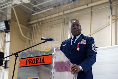 U.S. Air Force Chief Master Sgt. Marlon Burton, the command chief of the Illinois Air National Guard, addresses the audience during his retirement ceremony in Peoria, Illinois, May 3, 2026.
