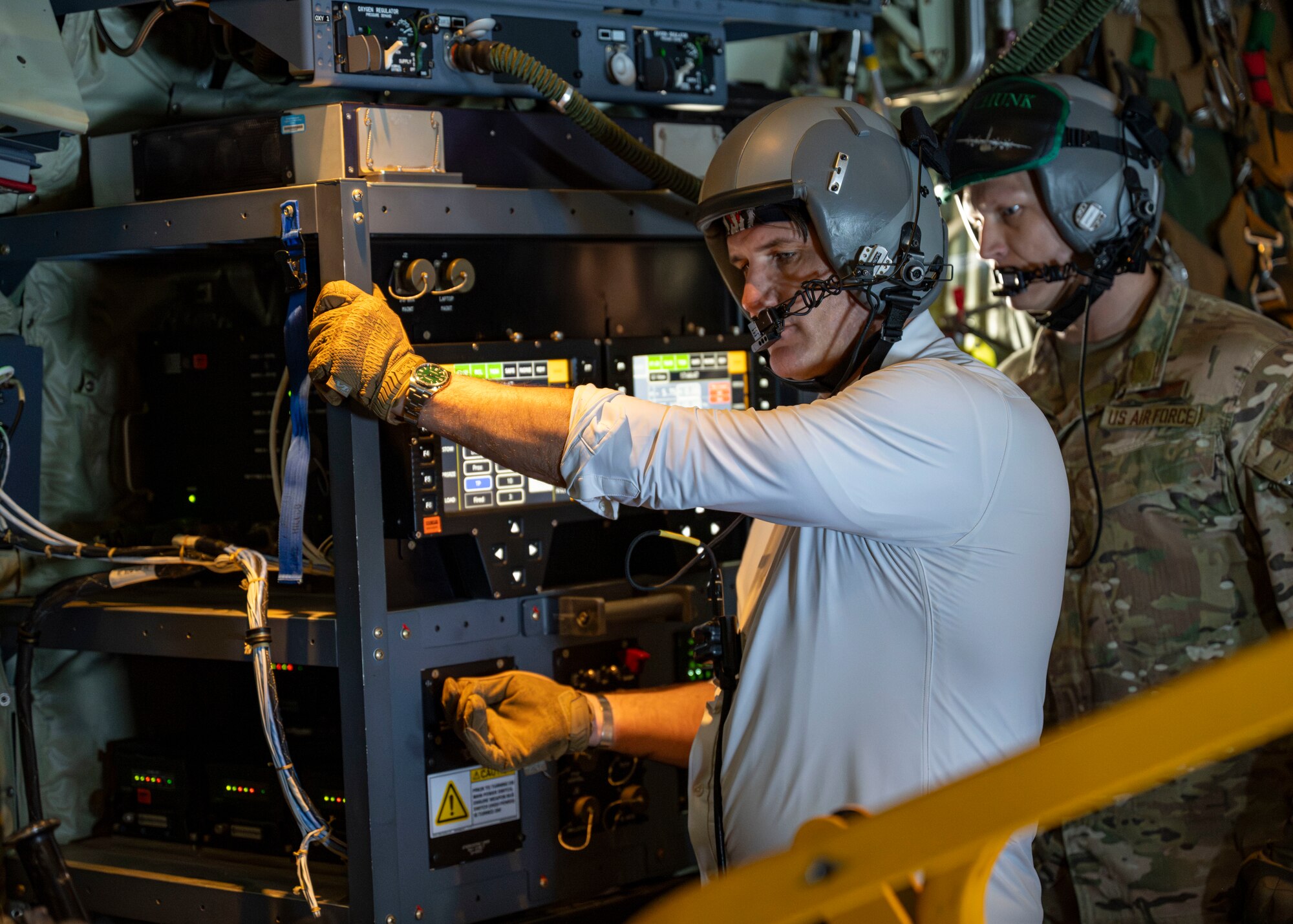 Derrick Anderson, Assistant Secretary of War for Special Operations and Low-Intensity Conflict, controls a 105 mm cannon aboard a 1st Special Operations Wing AC-130J Ghostrider during a familiarization flight