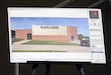 A display of what the building will look like with its new name on it stood in front of the auditorium during the naming ceremony at Boone National Guard Center in Frankfort, Ky., June 4, 2026. The auditorium adjacent to Wellman Armory was officially dedicated as the Brig. Gen. Larry C. Barker Auditorium, recognizing Barker’s decades of service and leadership within the Kentucky National Guard and the commonwealth. (U.S. Army National Guard photo by Sgt. 1st Class Benjamin Crane)