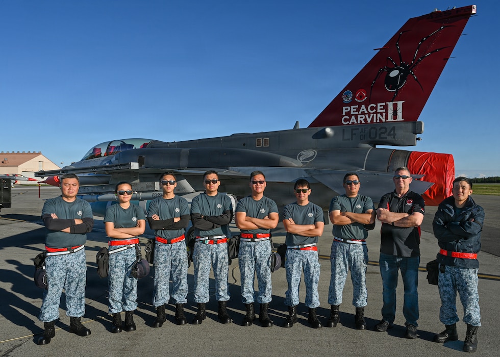Republic of Singapore Air Force maintainers assigned to the 425th Fighter Squadron stand for a group photo on the flight line at Eielson Air Force Base, Alaska, during RED FLAG-Alask 26-2, June 3, 2026.