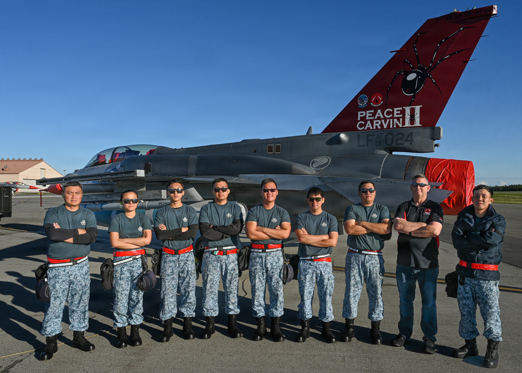 Republic of Singapore Air Force maintainers assigned to the 425th Fighter Squadron stand for a group photo on the flight line at Eielson Air Force Base, Alaska, during RED FLAG-Alask 26-2, June 3, 2026.