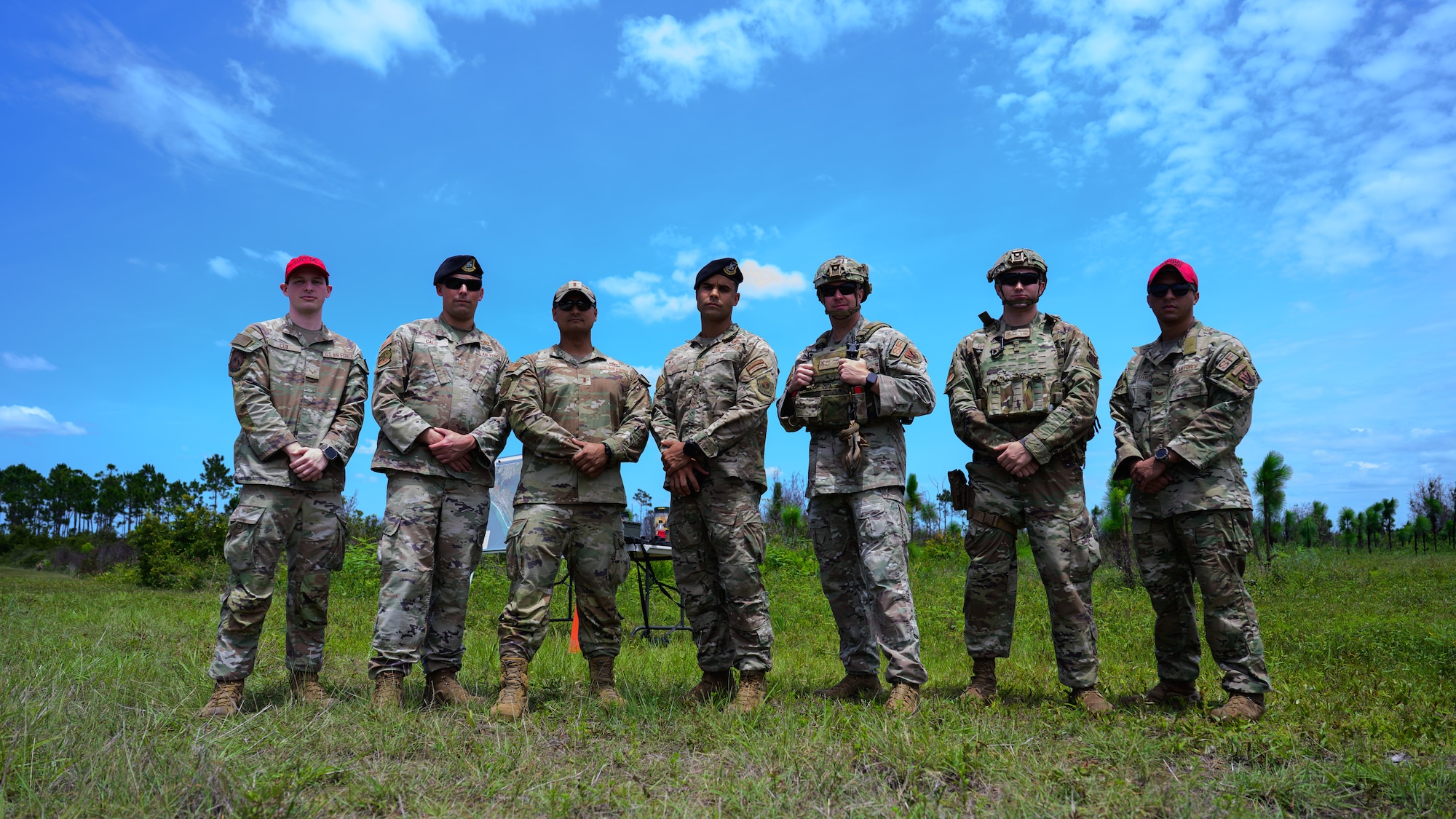 U.S. Airmen assigned to the 325th Security Forces Squadron pose for a photo during a base defense demonstration at Tyndall Air Force Base, Florida, June 3, 2026. The demonstration highlighted a training plan to qualify defenders on specialized weapon systems to neutralize small unmanned aircraft systems. The initiative is designed to establish a critical point-defense capability for the installation. (U.S. Air Force photo by Airman 1st Class Rosario Garcia)