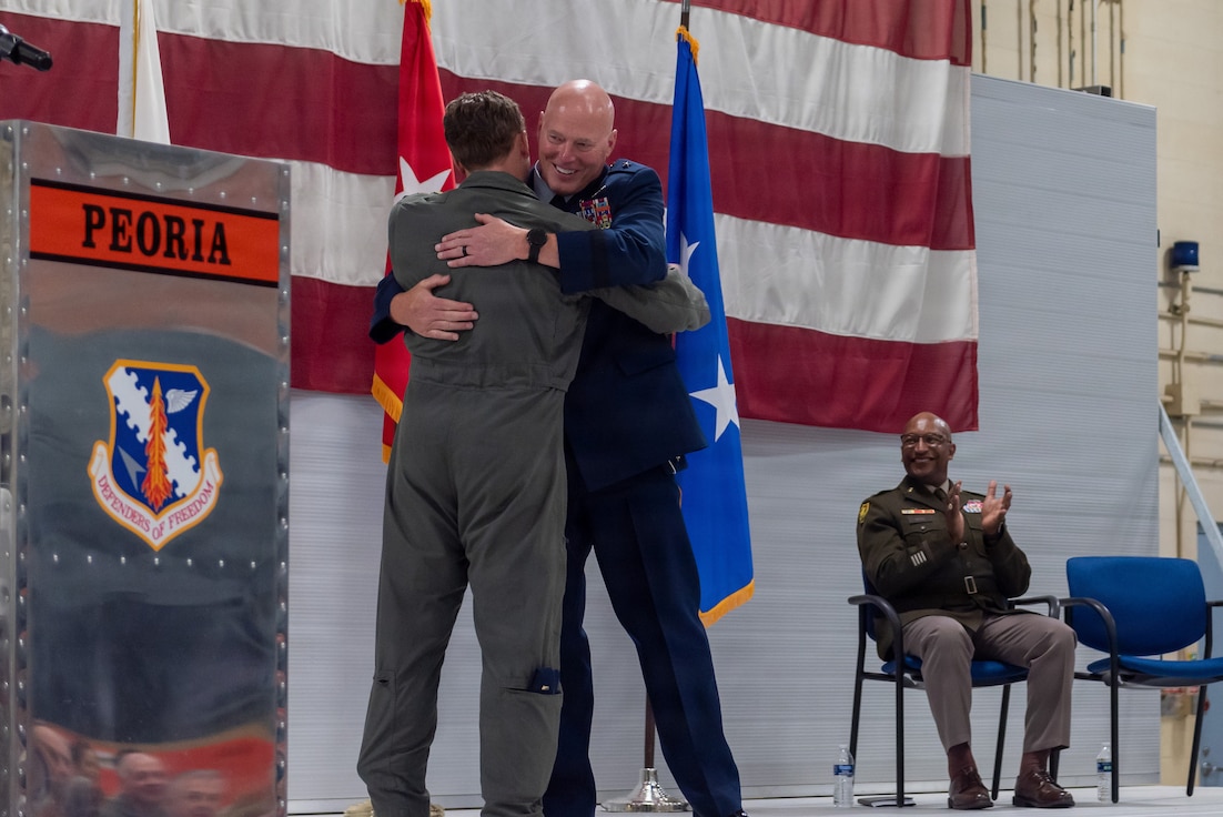 U.S. Air Force Maj. Gen. Daniel R. McDonough embraces his son, 2nd Lt. Danny McDonough, during a retirement ceremony at the 182nd Airlift Wing in Peoria, Illinois, June 6, 2026.