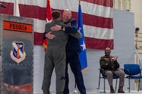 U.S. Air Force Maj. Gen. Daniel R. McDonough embraces his son, 2nd Lt. Danny McDonough, during a retirement ceremony at the 182nd Airlift Wing in Peoria, Illinois, June 6, 2026.