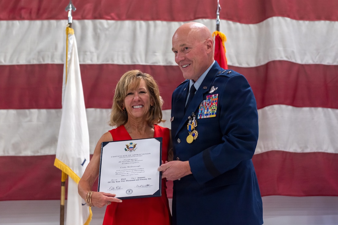 U.S. Air Force Maj. Gen. Daniel R. McDonough presents his wife, Cindy McDonough, with a Certificate of Recognition during his retirement ceremony at the 182nd Airlift Wing in Peoria, Illinois, June 6, 2026.