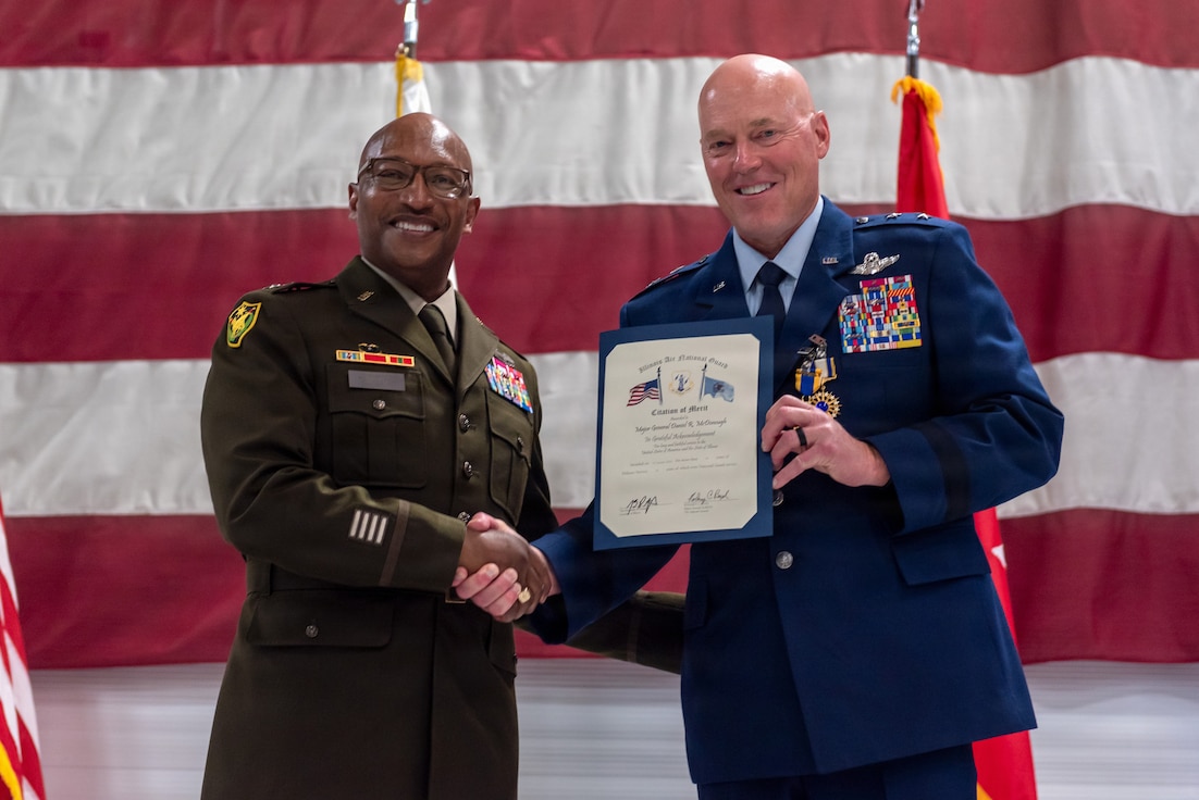 U.S. Army Maj. Gen. Rodney Boyd, left, presents U.S. Air Force Maj. Gen. Daniel R. McDonough with a Citation of Merit during a retirement ceremony at the 182nd Airlift Wing in Peoria, Illinois, June 6, 2026.