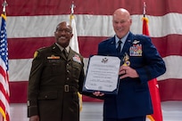 U.S. Army Maj. Gen. Rodney Boyd, left, and U.S. Air Force Maj. Gen. Daniel R. McDonough hold a Certificate of Retirement during a ceremony at the 182nd Airlift Wing in Peoria, Illinois, June 6, 2026.