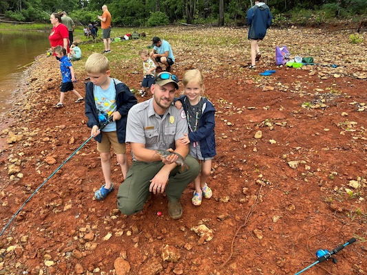 Ben Werner, natural resource specialist for the Savannah District, U.S. Army Corps of Engineers, poses for a photo with his two children during the Take Kids Fishing event May 23, 2026, at Modoc Fishing Pier on J. Strom Thurmond Lake in Modoc, South Carolina.