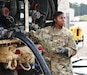 Staff Sgt. Abrijana Brewton, platoon sergeant, 53rd Quartermaster Company, 61st Quartermaster Battalion, 13th Armored Corps Sustainment Command, helps unload fuel for testing to ensure it is cleared for use, June 9, Camp Shelby, Miss. Brewton and her company are performing petroleum operations in support of Operation Sentinel Justice, the largest training event in the history of the Army Reserve, with an estimated 12,000 Soldiers participating. The Combat Support Training Exercise is designed to assess and enhance the readiness and capabilities of Army Reserve Soldiers in a modern dynamic, multi-echelon, and joint operational environment. (Photo by Maj. Alun Thomas, 377th Theater Sustainment Command Public Affairs)