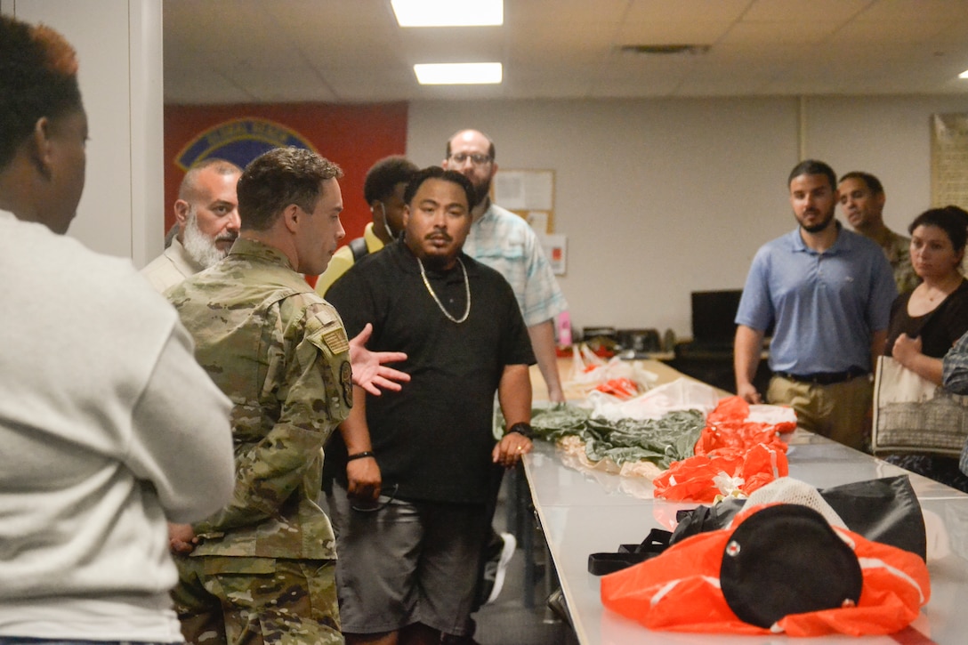 A service member answers questions from Defense Logistics Agency Troop Support Academy participants. The interactive tour allowed DLA's civilian workforce to engage directly with military end-users to better understand operational requirements and improve procurement efficiency.