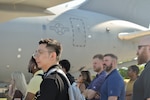 Defense Logistics Agency Troop Support Academy participants walk alongside a KC-46 Pegasus aircraft assigned to the New Jersey Air National Guard’s 108th Wing during a flight line tour. Nearly 100 newer DLA Troop Support employees visited the joint base to observe how the equipment, clothing, and subsistence they procure directly support active global aerial refueling and aeromedical evacuation missions.