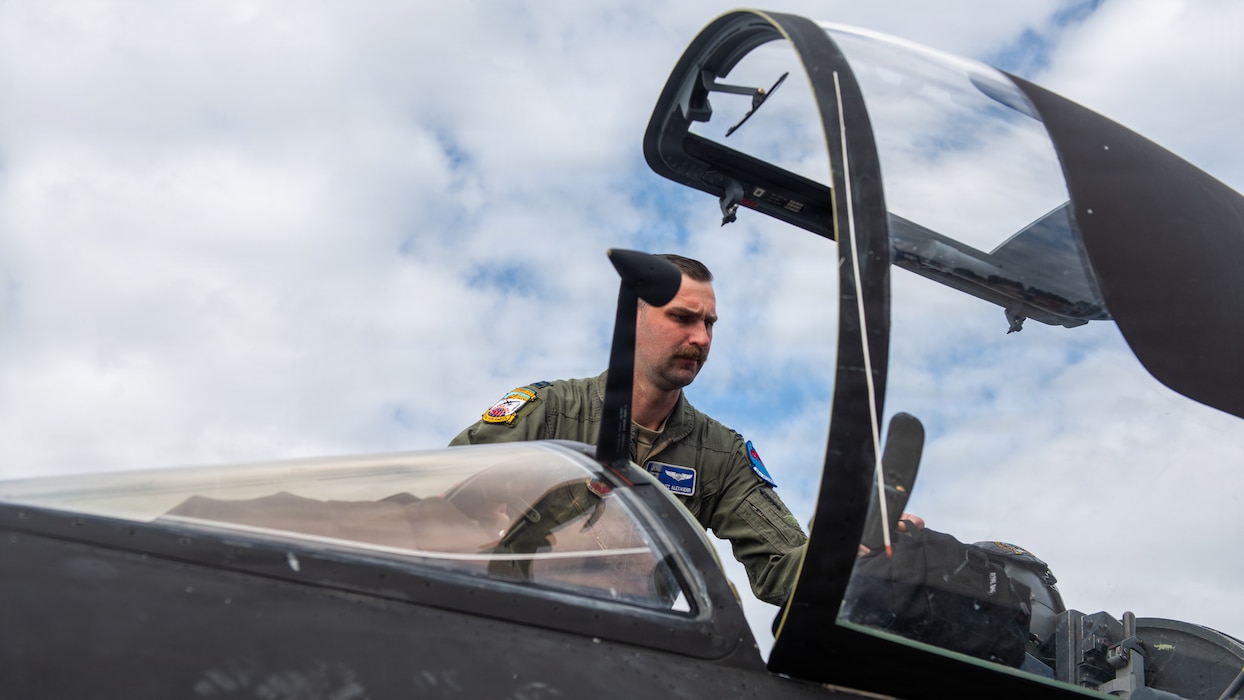 Pilot prepares to enter aircraft cockpit