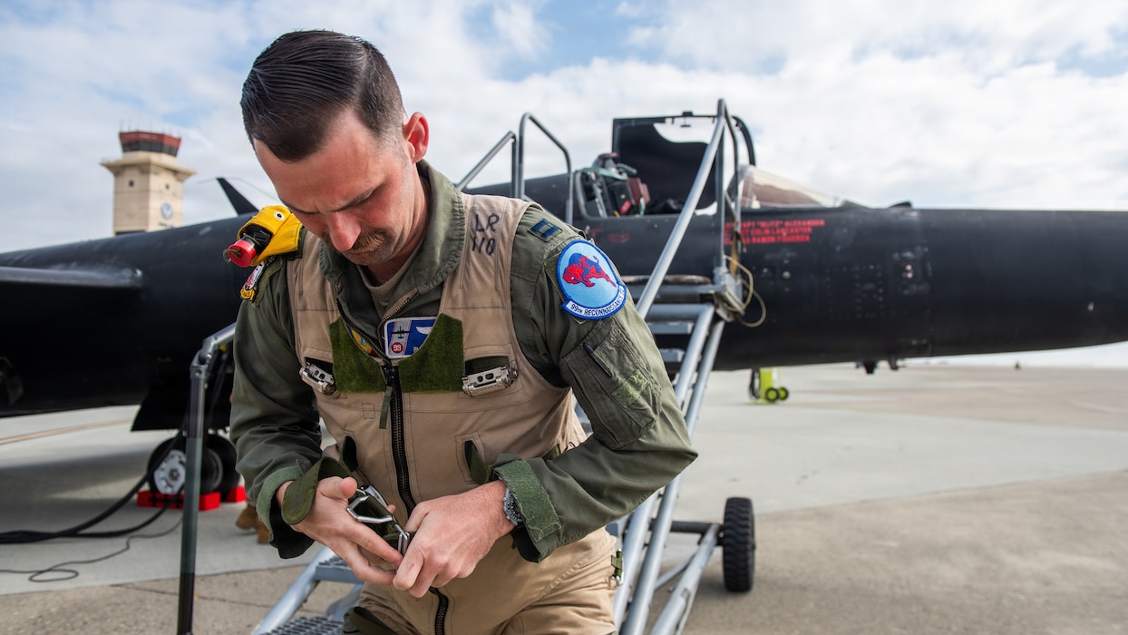 Pilot dons aircraft flight equipment
