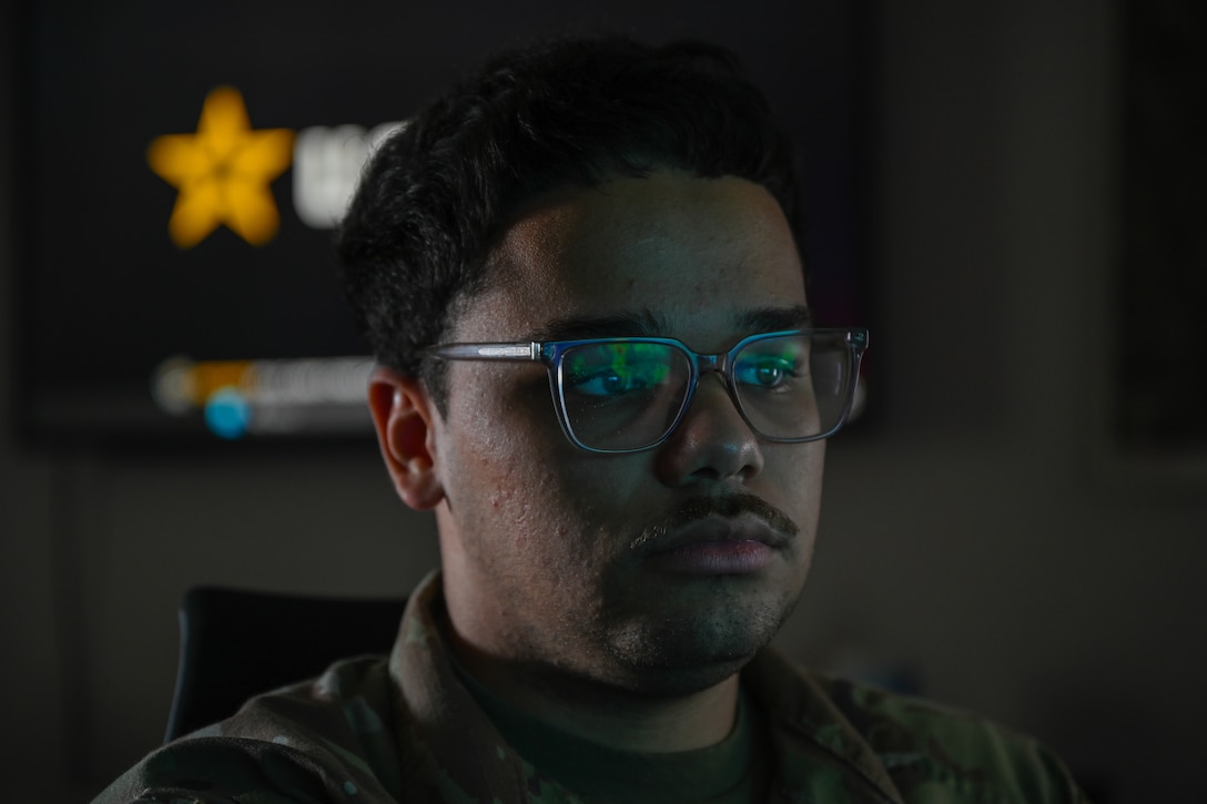 Weather forecast reflects off an Airman's glasses. (U.S. Air Force photo by Airman 1st Class Donnell Ramsey)