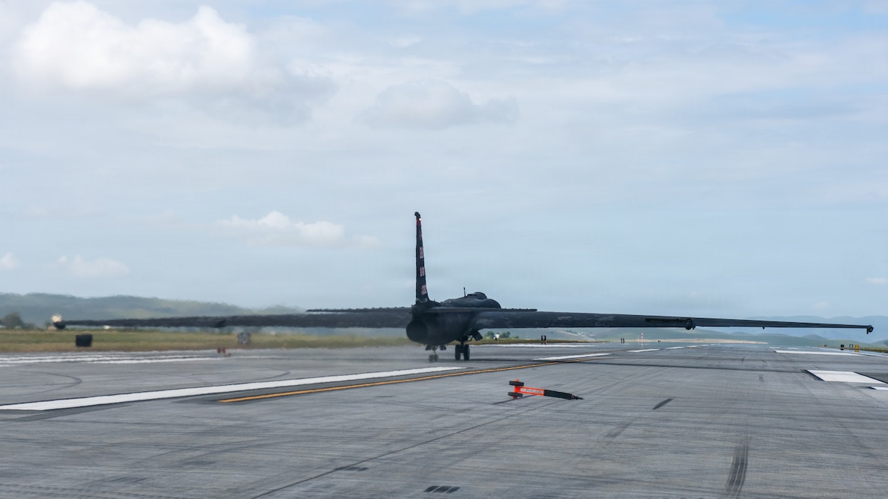 An aircraft taxis down runway