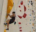 A man climbing a wall.