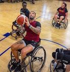 Retired U.S. Army Chief Warrant Officer 3 Jonathan Tallman, a Team Army athlete selected for the Ultimate Champion competition, participates in wheelchair basketball practice.
