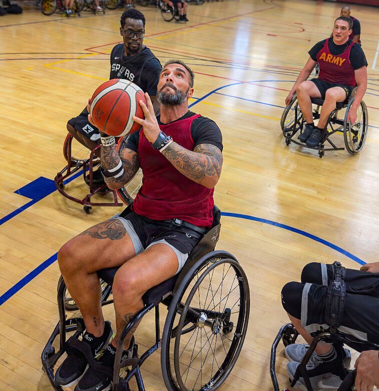 Retired U.S. Army Chief Warrant Officer 3 Jonathan Tallman, a Team Army athlete selected for the Ultimate Champion competition, participates in wheelchair basketball practice.