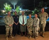 The Hon. Sitiveni Rabuka, Prime Minister of Fiji, center, poses for a photo with a U.S. Coast Guardsman and Sailors, assigned to Naval Mobile Construction Battalion (NMCB) 1, during a visit to discuss their two-room schoolhouse construction project at Nabua Village in SavuSavu, Fiji, June 3, 2026