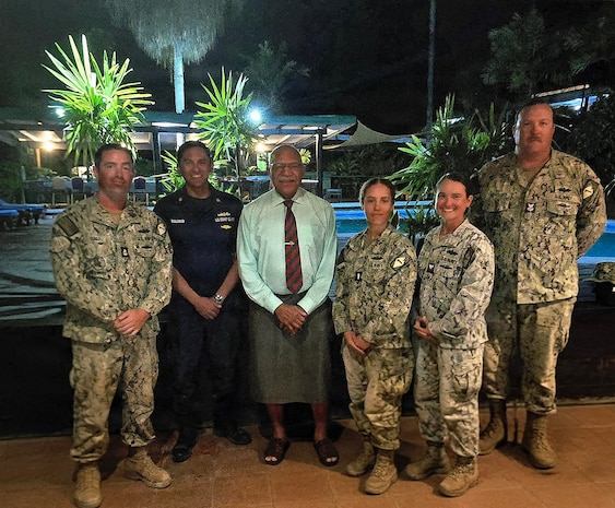 The Hon. Sitiveni Rabuka, Prime Minister of Fiji, center, poses for a photo with a U.S. Coast Guardsman and Sailors, assigned to Naval Mobile Construction Battalion (NMCB) 1, during a visit to discuss their two-room schoolhouse construction project at Nabua Village in SavuSavu, Fiji, June 3, 2026