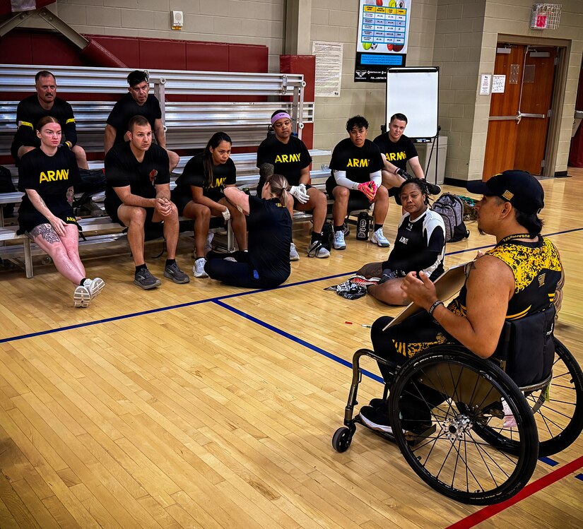 Team Army competitors listen as retired Army Staff Sgt. Joel Rodriguez, Team Army wheelchair rugby coach, speaks to the team before practice during the Army Team Sports Camp in San Antonio, Texas, May 5, 2026.