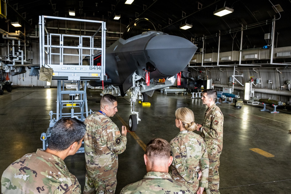 U.S. Air Force Lt. Gen. Laura Lenderman, second from right, Pacific Air Forces deputy commander, tours an F-35 Lightning II hangar with the 13th Fighter Generation Squadron during her visit.