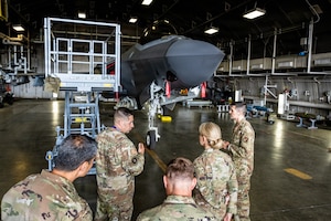 U.S. Air Force Lt. Gen. Laura Lenderman, second from right, Pacific Air Forces deputy commander, tours an F-35 Lightning II hangar with the 13th Fighter Generation Squadron during her visit.