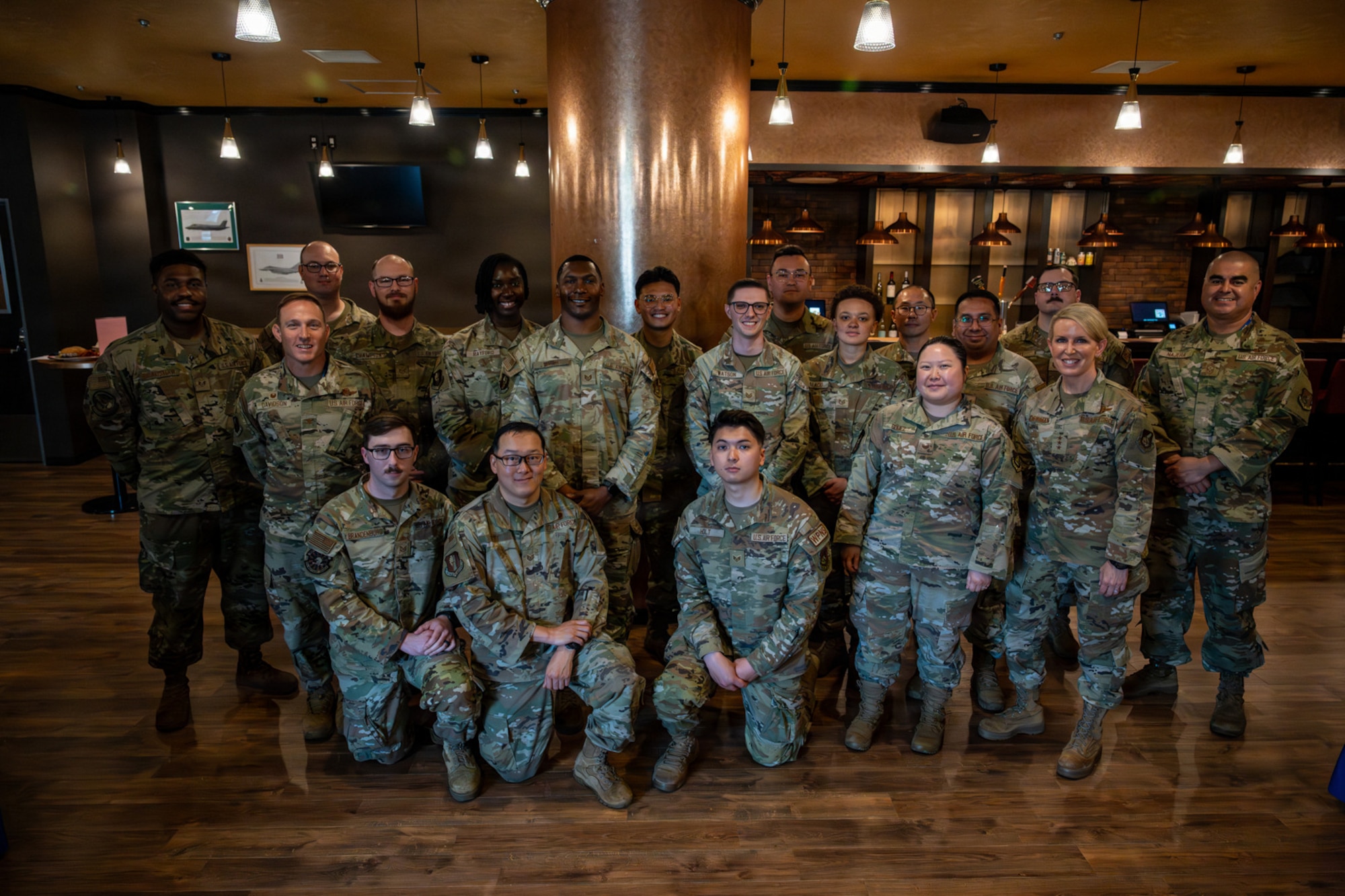 U.S. Air Force Lt. Gen. Laura Lenderman, second from right, Pacific Air Forces deputy commander, stands for a photo with noncommissioned officers assigned to the 35th Fighter Wing during a mentorship lunch.